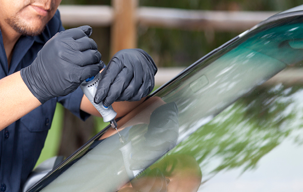 Man repairing windshield